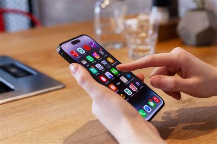 Can you see what someone is doing on their iPhone?