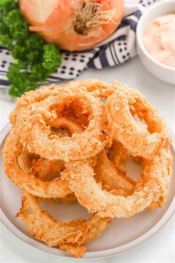 Which has less carbs French fries or onion rings?